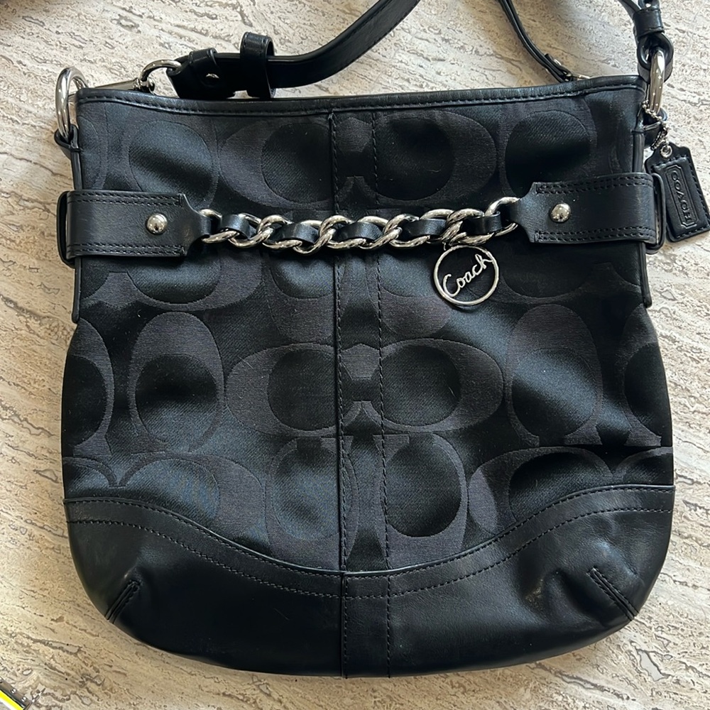Pre-owned COACH black crossbody bag.